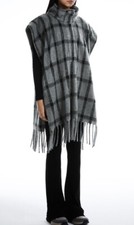 Oversized poncho with fringing