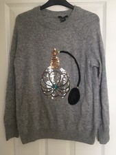 Stylish H&M grey jumper with sequin perfume bottle pattern. Size Euro S