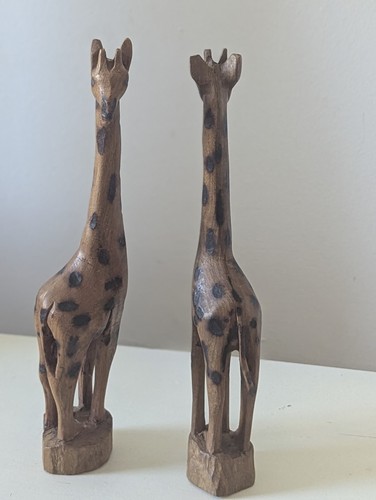 Hand carved wooden giraffe - hand,