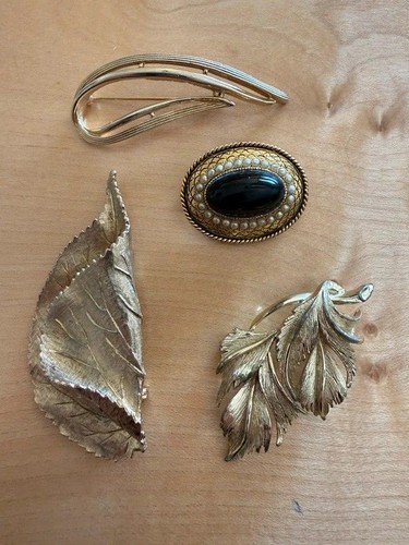 Four vintage designer brooches - four,
