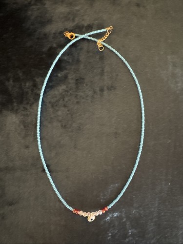 Turquoise beaded evil - beaded,