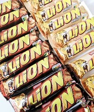 NESTLE LION CHOCOLATE AND WHITE BARS. 18 BARS. 9 EACH.