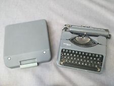 Grey Hermes Baby typewriter in