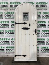 ARCHED STUDDED FROND DOOR