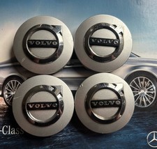 Four Genuine Volvo Wheel Caps