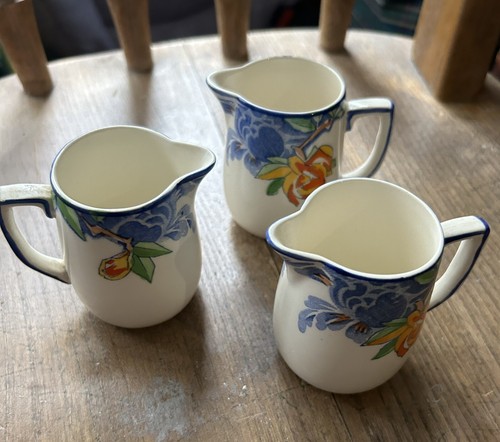 Three individual milk jugs - three,