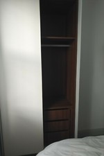 Wardrobe with sliding doors and internal draws unit
