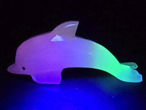 Glowing rainbow dolphin carved - glowing,