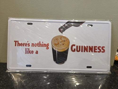 Guinness sign small tin man - tin,