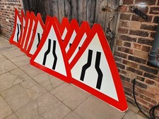 ROAD NARROWS ON BOTH SIDES