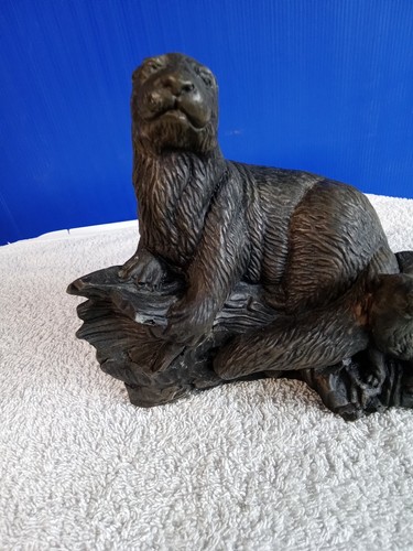 Bronze otter with cub - ,