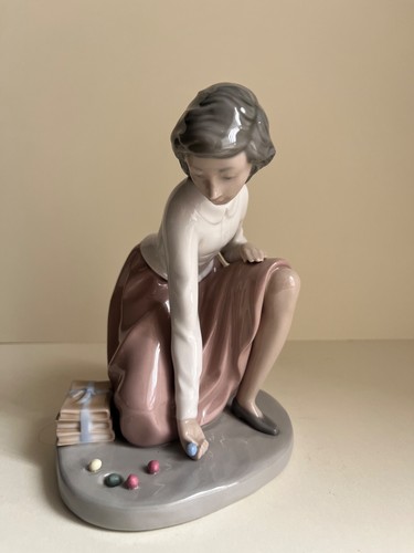 Nao lladro figurine playing - by,