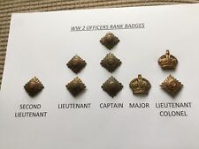 A SET OF WW2 OFFICERS BRASS