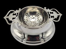 SOLID SILVER TEA STRAINER AND