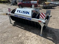 Tusk Silage Compactor. Tractor