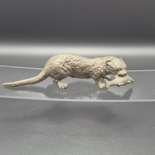 BRONZE FIGURE OF AN OTTER WITH