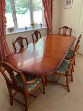Extending yew pedestal dining