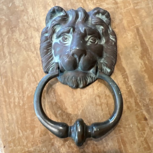 Antique brass lions - head, door