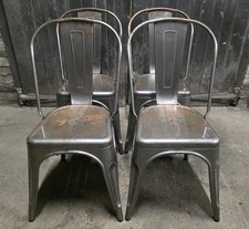 Four Tolix Style Industrial Metal Stacking Dining Chairs