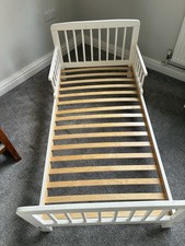 White wooden toddler bed