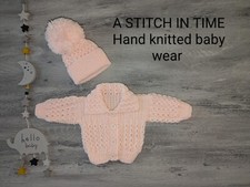 babies. hand. knitted. aran. cardigans