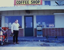 1980s Man by Coffee Shop Moped