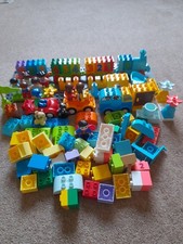 LEGO STORAGE BOX WITH OVER 100 DUPLO BRICKS INCLUDING SUPERMAN FIGURE.