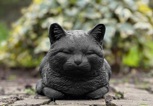 Laying sleeping cat statue