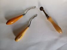 Two Readicut latch rug key hooks and piercing stitch guide wheel Wooden handles