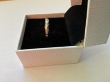 Full hoop diamond set wedding band in all platinum. Made and designed by Boodles