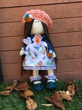 Tilda doll holding handmade
