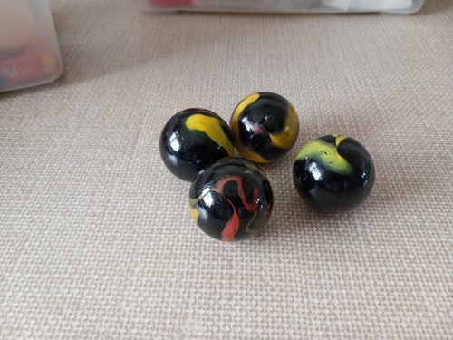Large marbles black with - x,