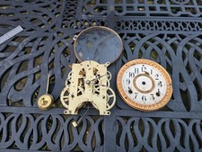 Antique 8 day ANSONIA  clock movement, dial, hands, pendulum and bezel