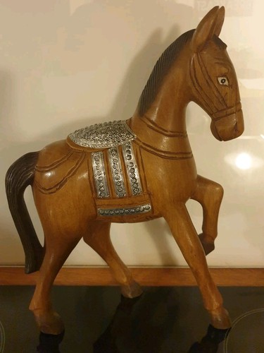 Tall carved wooden horse with