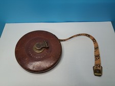 Vintage tape measure, a John
