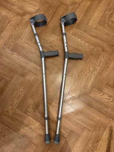 Pair elbow crutches days - of,