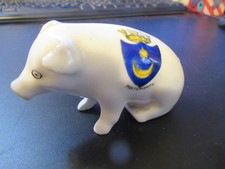 Crested china seated pig, arms