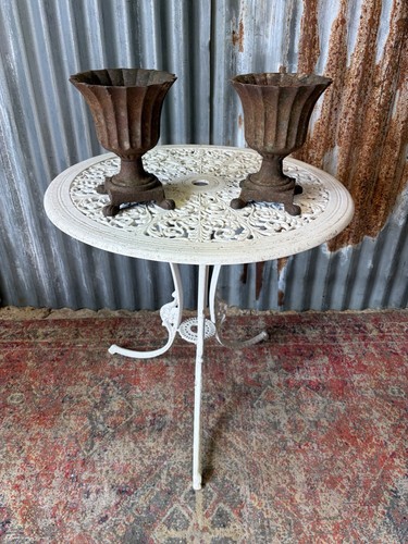 Antique rusty cast iron urn - rusty,