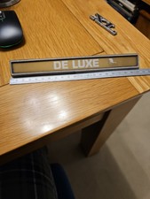 Used Genuine De Luxe Car Badge