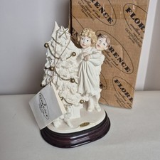 Giuseppe Armani  Trimming The