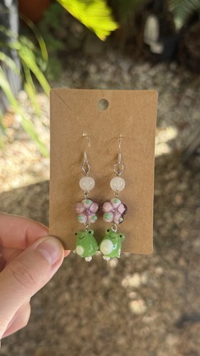 Glass green frog and pink - frog,