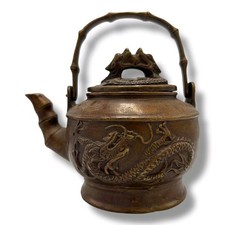 An antique Chinese Bronze Dragon-Relief Teapot. Patinated bronze, raised dragon 