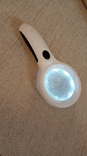 Hand held magnifier with - hand,