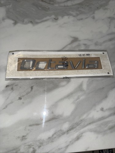 Rear tailgate emblem genuine - rear,