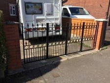 Bi-fold driveway wrought iron gates design PJN24