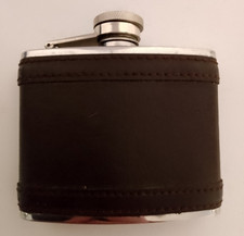 Stainless steel 4oz vintage hip flask with leather casing.