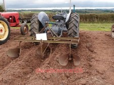 PHOTO  THREE ROW POTATO RIDGER PART OF A DISPLAY BY A VINTAGE PRESERVATION GROUP