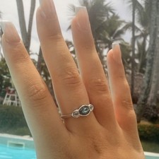 Ladies ring silver-filled criss-cross zirconia ring with aqua stones