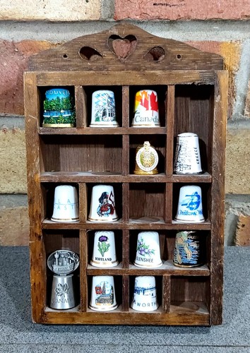 Thimble display case with - thimble,
