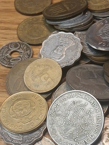 Pounds foreign coins - 3+,